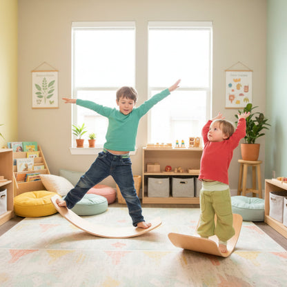 Two children balancing on wooden balance boards against a white background