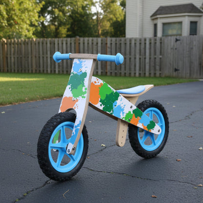 Children's balance bike with colorful design on a white background